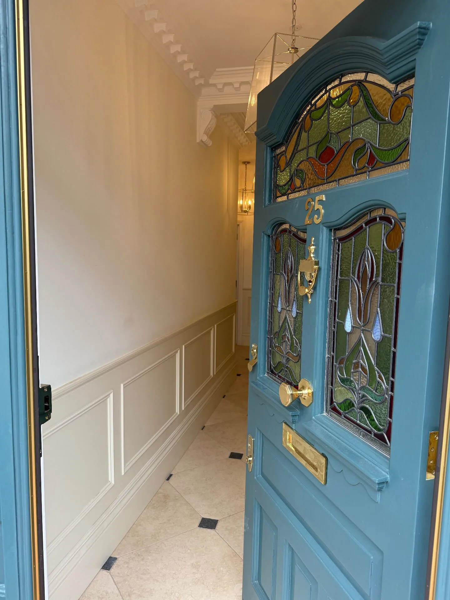 First-time buyer reviewing a UK property listing with a builder before making an offer